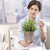 weiblichen · Büroangestellte · halten · Topfpflanze · Sitzung · Schreibtisch - stock foto © nyul