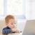 Ginger-haired toddler using laptop at home  stock photo © nyul