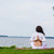 Pregnant woman is practicing yoga beside river stock photo © O_Lypa