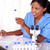 Ethnic scientific woman working with test tube stock photo © pablocalvog