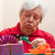 a senior citizen wrap or unpack presents, closeup stock photo © Pasiphae