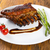 Tasty grilled ribs with vegetables  stock photo © paulovilela