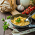 Scrambled eggs with herbs and homemade bread stock photo © Peteer