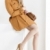 sitting woman wearing brown coat and pumps with a handbag stock photo © phbcz