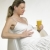 pregnat woman with a glass of juice stock photo © phbcz