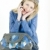 portrait of sitting woman with mobile phone and handbag stock photo © phbcz