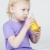 portrait of little girl drinking orange juice stock photo © phbcz