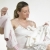 pregnat woman with clothes for babies stock photo © phbcz