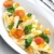 pasta penne with spinach and cherry tomatoes stock photo © phbcz