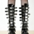 detail of standing woman wearing extravagant boots stock photo © phbcz