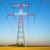 Electricity transmission pylon silhouetted against blue stock photo © pixinoo