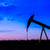 Silhouette of Oil pumps at oil field with sunset sky background stock photo © pixinoo