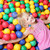 entspannenden · Mädchen · glücklich · farbenreich · Kugeln · schauen · Kamera - stock foto © pressmaster