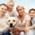 среднее · Семейный · портрет · счастливая · семья · сидят · диван · собака - Сток-фото © pressmaster