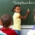 schoolmeisje · afbeelding · Blackboard · naar · camera · klasgenoten - stockfoto © pressmaster