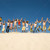 dinâmico · pessoas · multidão · amigos · saltando · praia - foto stock © pressmaster
