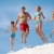 dynamisme · photo · famille · heureuse · sautant · sable · vacances · d'été - photo stock © pressmaster