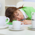 Beautiful woman sleeps on workplace with coffee cups stock photo © pzaxe