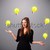 young lady standing and juggling with light bulbs stock photo © ra2studio