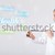 young lady standing and holding a phone with copy space stock photo © ra2studio
