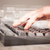 Hand touching keyboard with high tech buttons stock photo © ra2studio