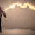 Business man defending himself from a fire arrow with an umbrell stock photo © ra2studio
