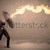 Business man defending himself from a fire arrow with an umbrell stock photo © ra2studio