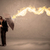 Business man defending himself from a fire arrow with an umbrell stock photo © ra2studio