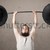 Funny skinny guy lifting weights stock photo © ra2studio
