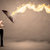 Business man defending himself from a fire arrow with an umbrell stock photo © ra2studio