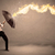 Business man defending himself from a fire arrow with an umbrell stock photo © ra2studio