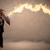 Business man defending himself from a fire arrow with an umbrell stock photo © ra2studio