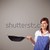 Young lady holding a frying pan stock photo © ra2studio