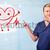 Attractive doctor with happy red smiling heart stock photo © ra2studio