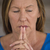 Praying woman hopeful thoughtful closed eyes stock photo © roboriginal
