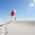 Pretty woman walking up sand dune in summer heat stock photo © roboriginal