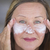 Confident mature woman face creme skin care stock photo © roboriginal