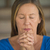 Woman praying closed eyes folded hands stock photo © roboriginal