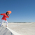 Woman dancing and balancing on sand dune stock photo © roboriginal