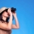 Woman in safari hat searching with binoculars stock photo © RTimages