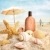 Suntan lotion and seashells on the beach stock photo © Sandralise