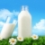 Bottle and glass of milk with grass and daisies  stock photo © Sandralise