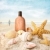 Suntan lotion and seashells on the beach stock photo © Sandralise