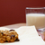 Freshly baked oatmeal raisin cookie with a glass of milk stock photo © sarahdoow