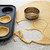 Pastry circles being cut and filling a bun tin to make jam tarts stock photo © sarahdoow