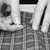 Closeup of two hands pinning plaid fabric stock photo © sarahdoow