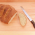 Bread knife with a freshly baked loaf stock photo © sarahdoow