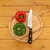 Red and green peppers with a knife on a chopping board  stock photo © sarahdoow