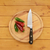 Red and green chilis with a knife on a chopping board stock photo © sarahdoow