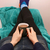 Woman holding a hot drink, relaxing with her feet up stock photo © sarahdoow